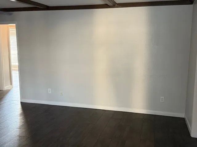 a kitchen with granite countertop a stove and a microwave