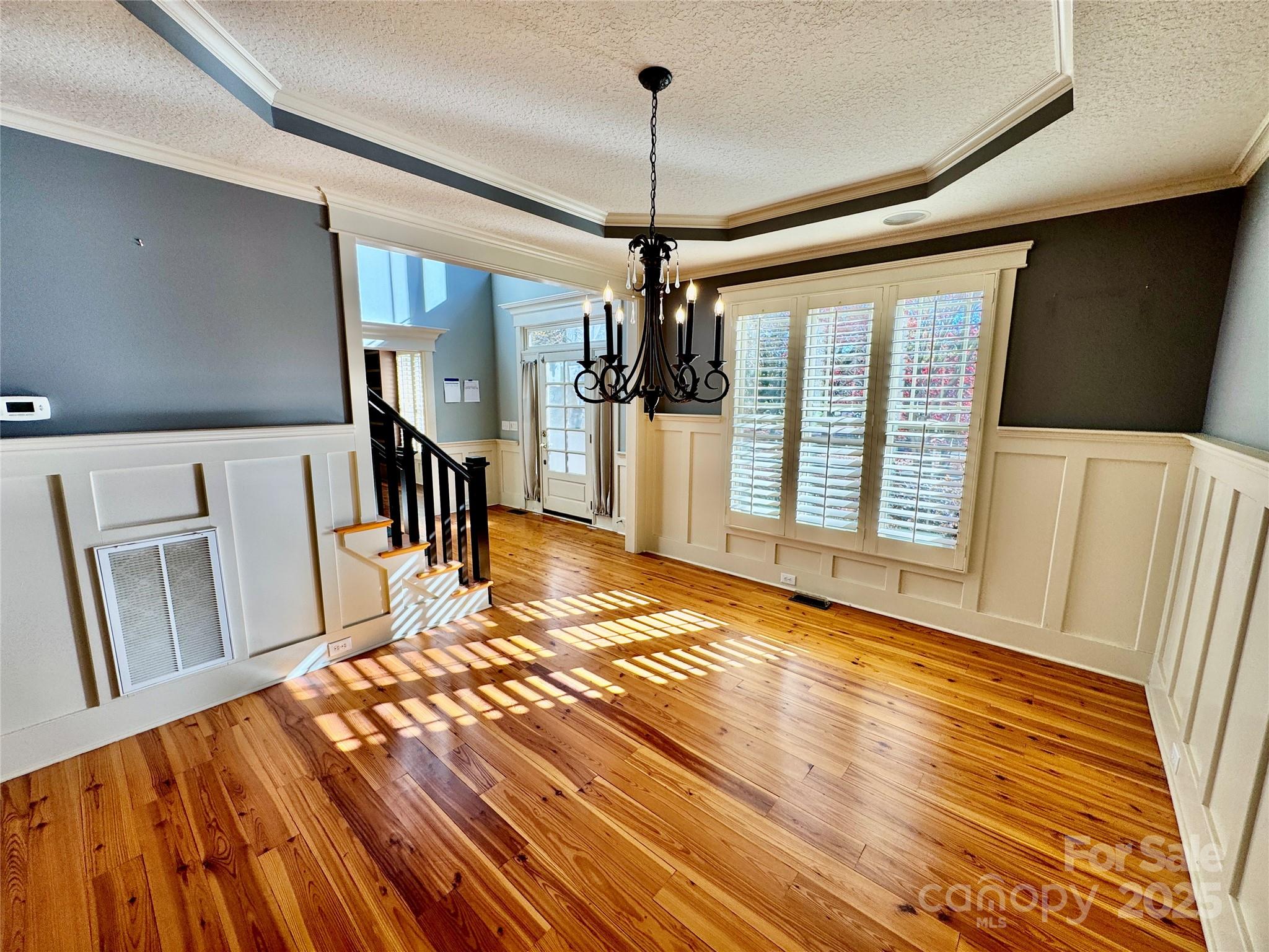 600 Baron Road Waxhaw, NC 28173 - Photo 11 of 42 a view of empty room with wooden floor and fan