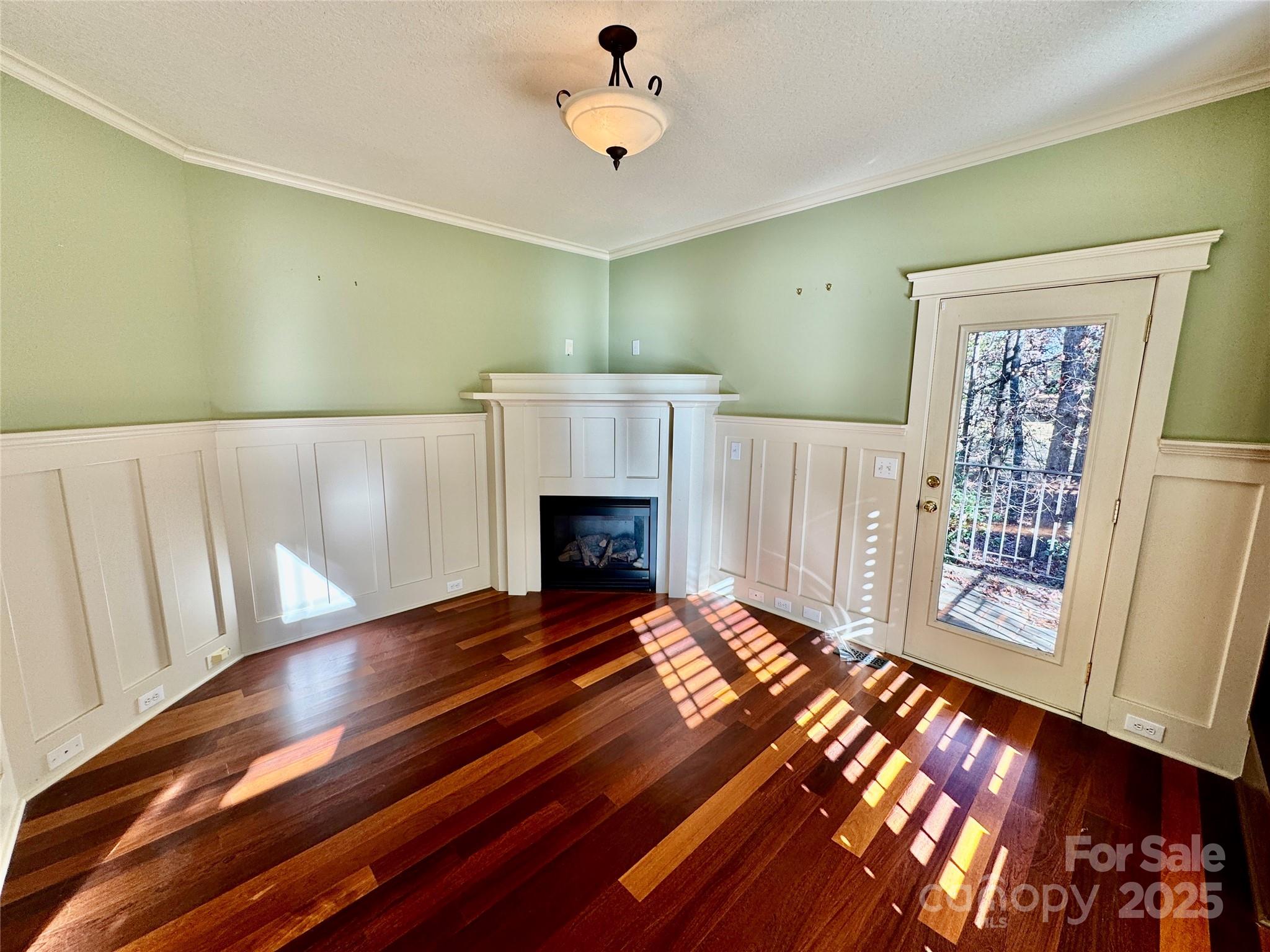 600 Baron Road Waxhaw, NC 28173 - Photo 12 of 42 a view of an empty room with wooden floor and a window