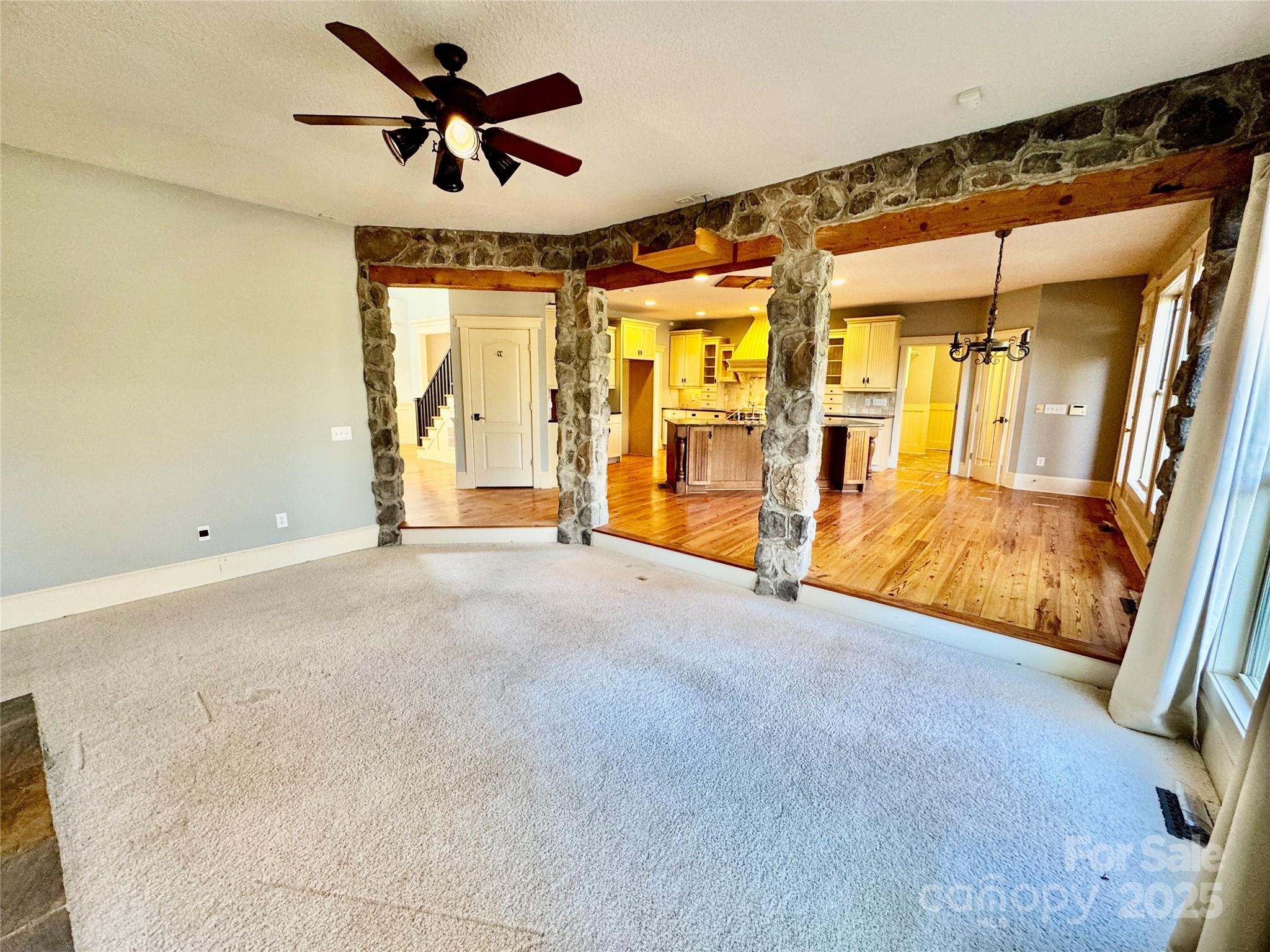 600 Baron Road Waxhaw, NC 28173 - Photo 14 of 42 a view of empty room with wooden floor and fan