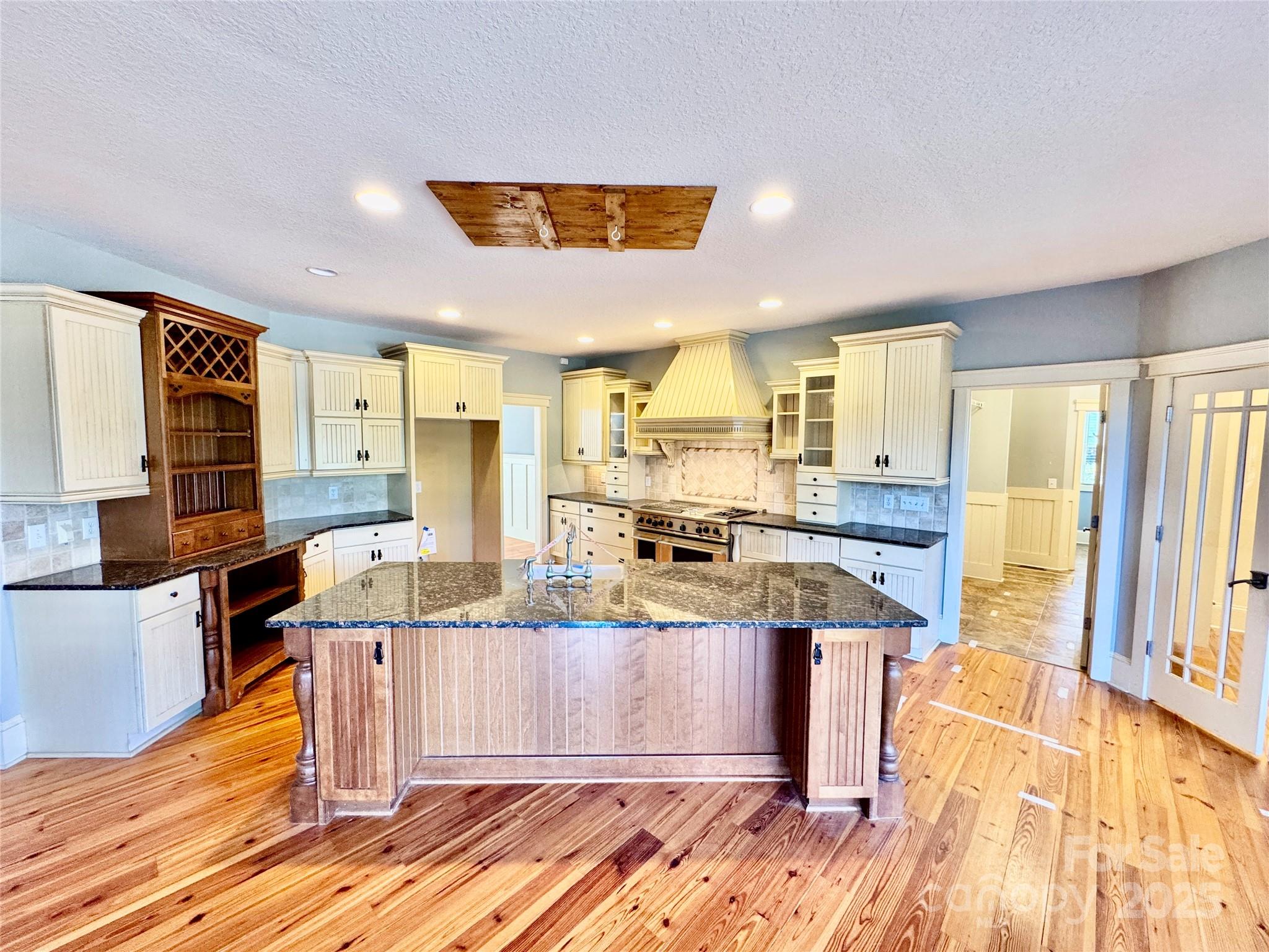 600 Baron Road Waxhaw, NC 28173 - Photo 18 of 42 a large kitchen with stainless steel appliances kitchen island granite countertop a large cabinets and a sink