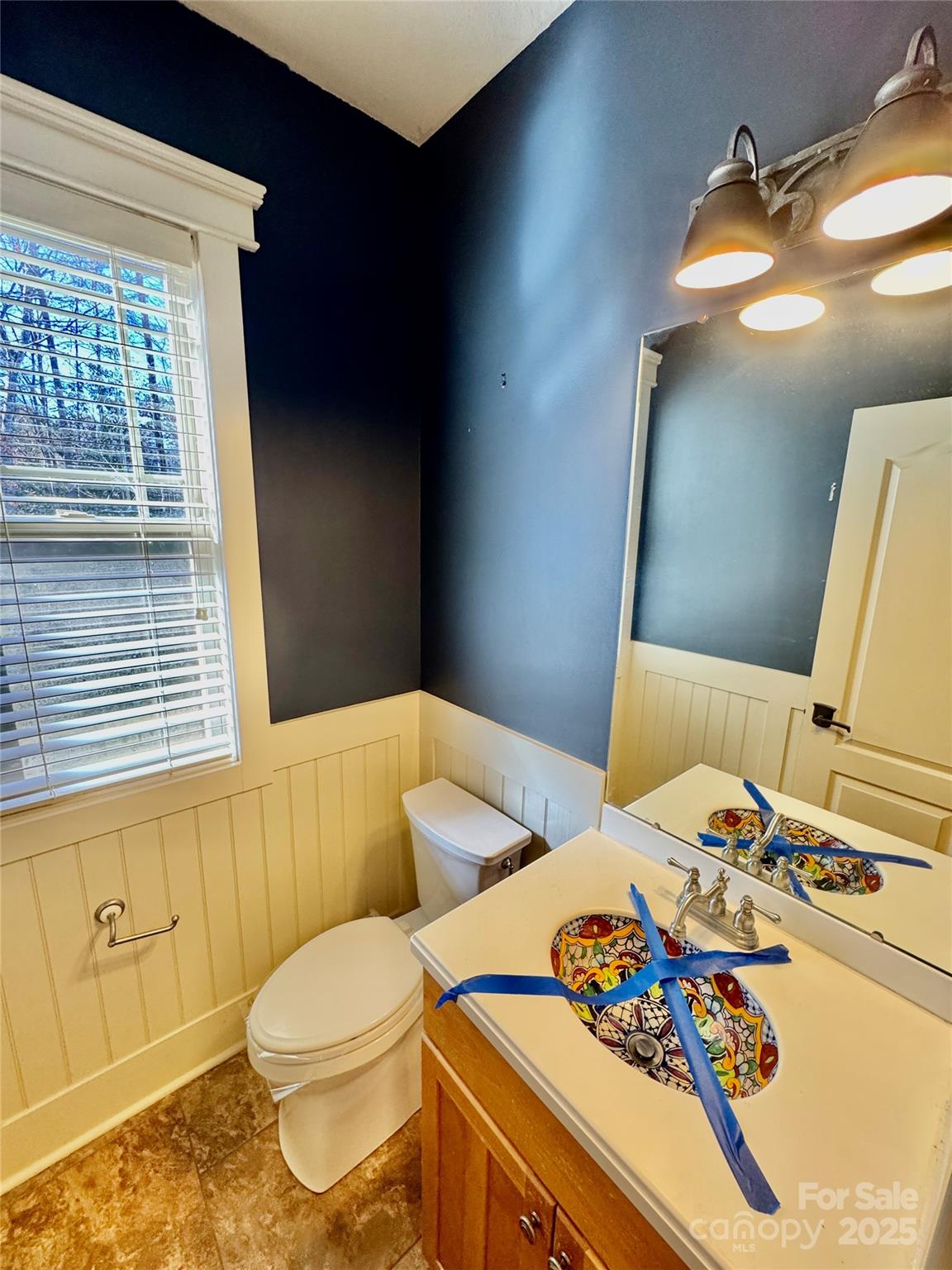 600 Baron Road Waxhaw, NC 28173 - Photo 20 of 42 a bathroom with a sink a toilet and shower curtain
