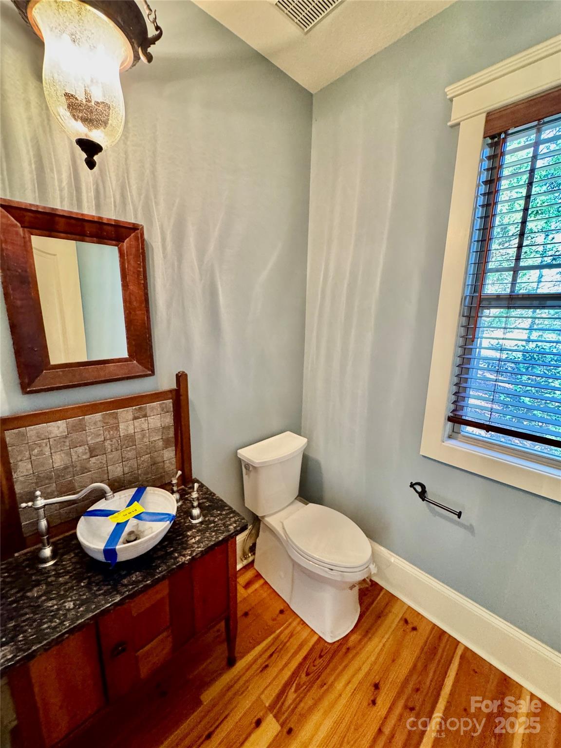 600 Baron Road Waxhaw, NC 28173 - Photo 21 of 42 a bathroom with a sink toilet and window