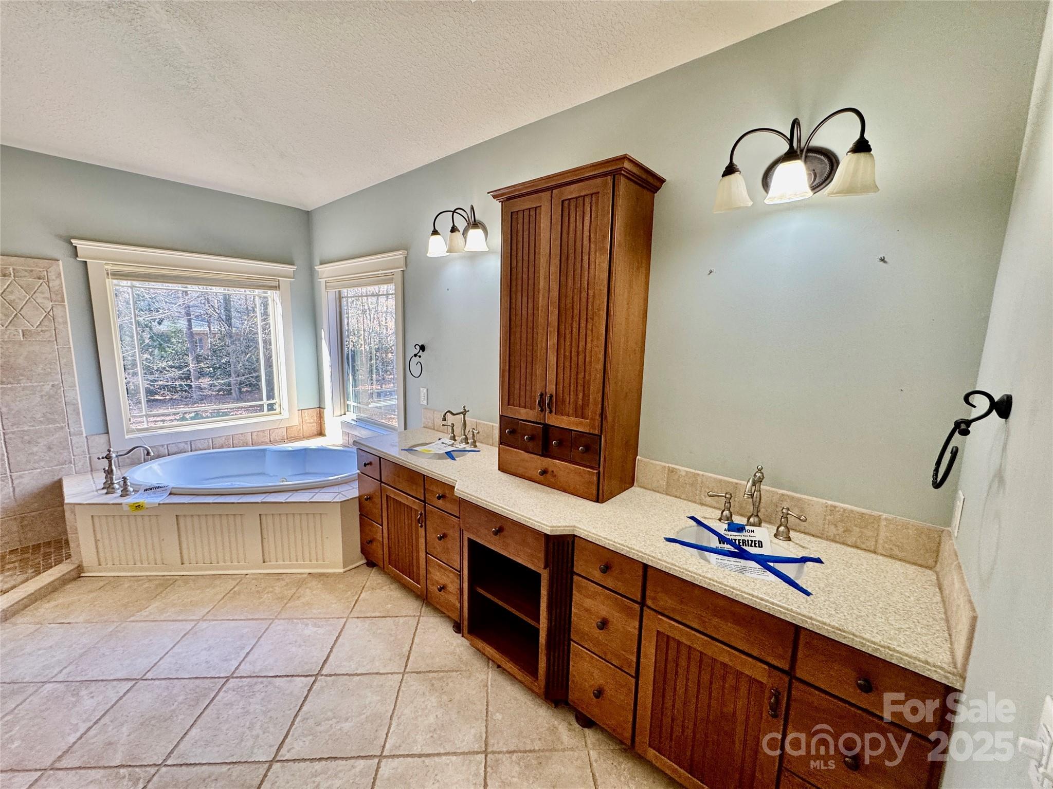 600 Baron Road Waxhaw, NC 28173 - Photo 28 of 42 a bathroom with a tub sink and mirror
