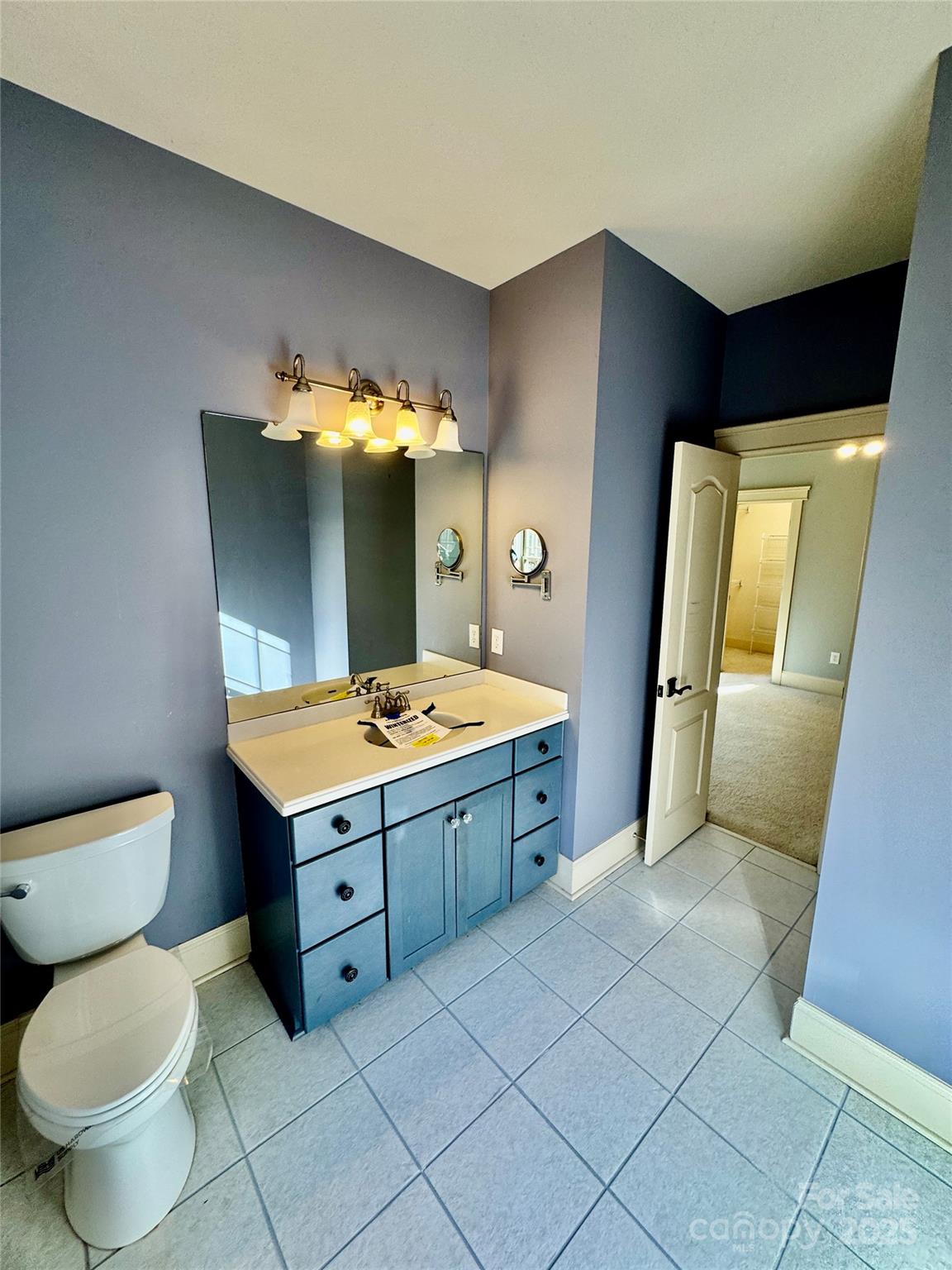 600 Baron Road Waxhaw, NC 28173 - Photo 38 of 42 a bathroom with a sink and mirror