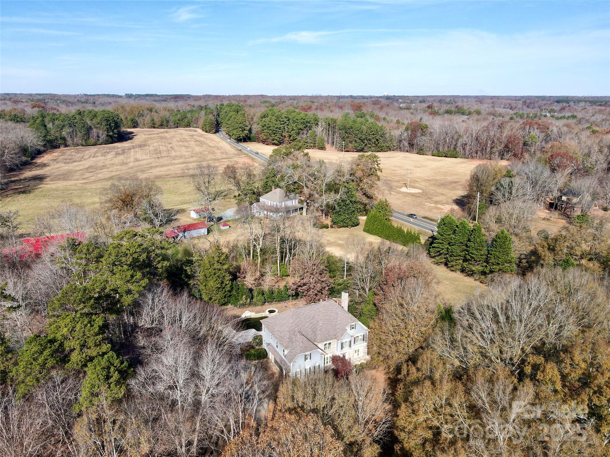 600 Baron Road Waxhaw, NC 28173 - Photo 8 of 42 a view of a houses with green field and mountains