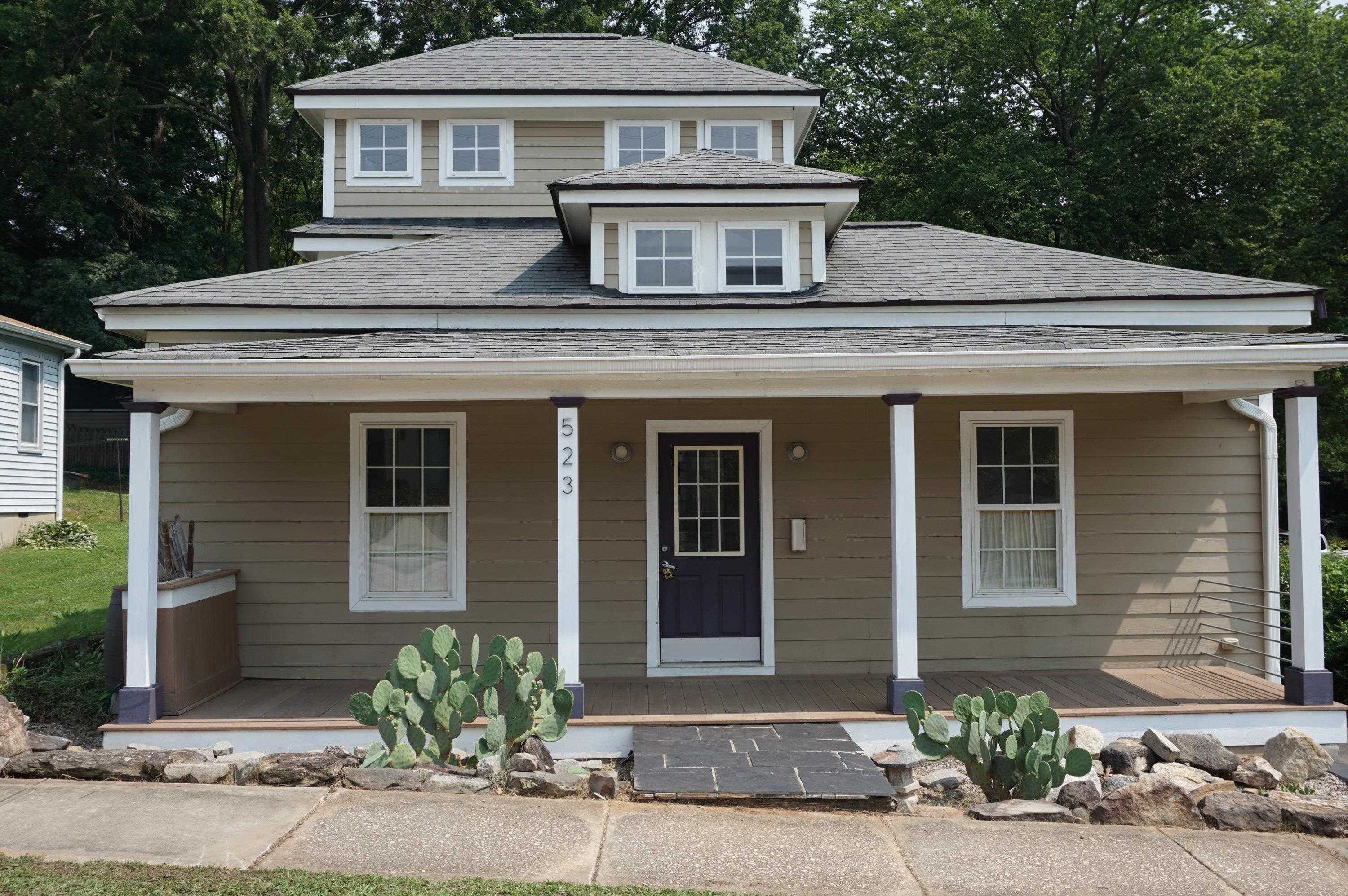 a front view of a house with yard