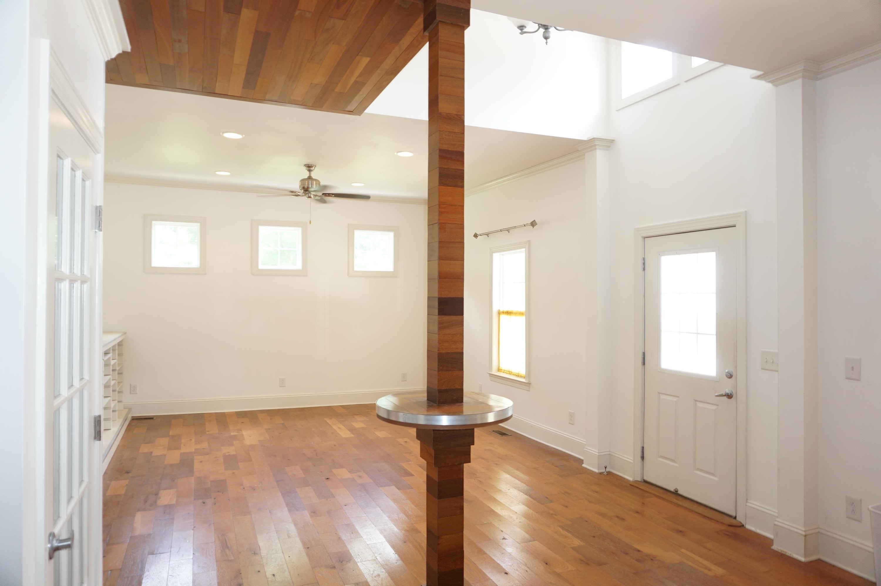 523 East Edenton Street Raleigh, NC 27601 - Photo 13 of 53 an empty room with wooden floor and windows