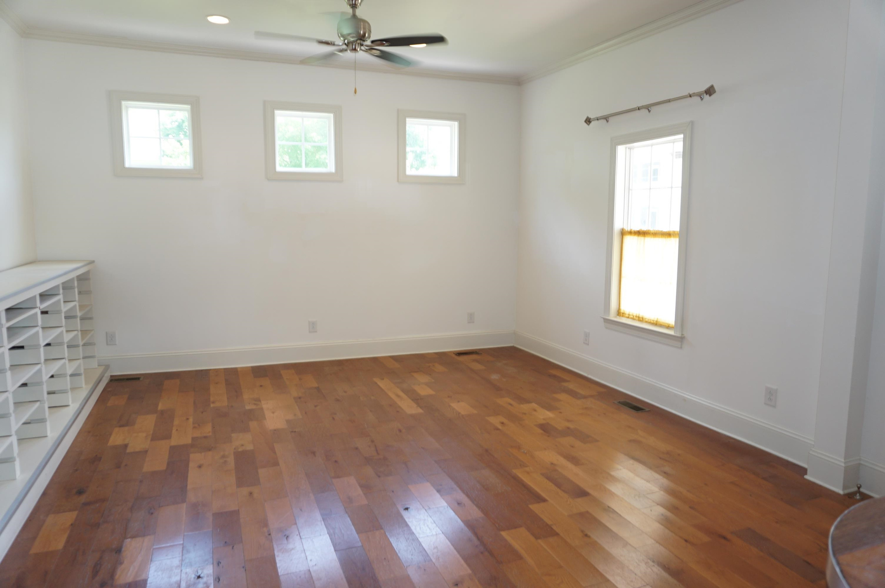 523 East Edenton Street Raleigh, NC 27601 - Photo 14 of 53 an empty room with wooden floor and windows