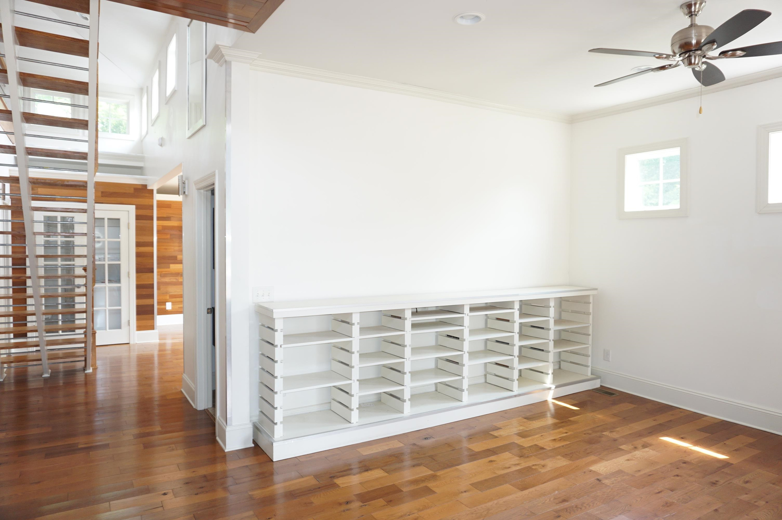 523 East Edenton Street Raleigh, NC 27601 - Photo 17 of 53 a view of an empty room with wooden floor and a window