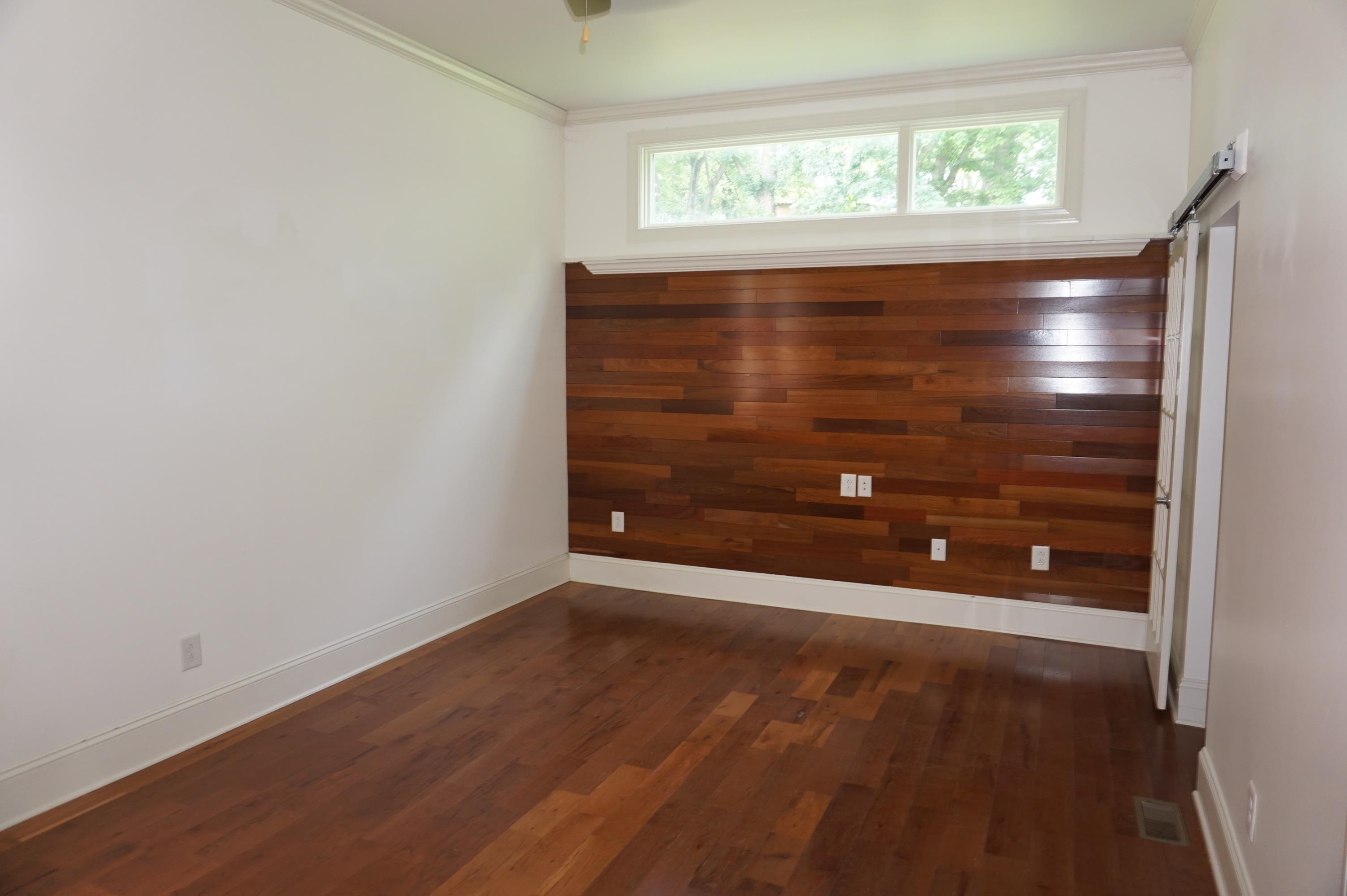 523 East Edenton Street Raleigh, NC 27601 - Photo 18 of 53 a view of an empty room with wooden floor and a window