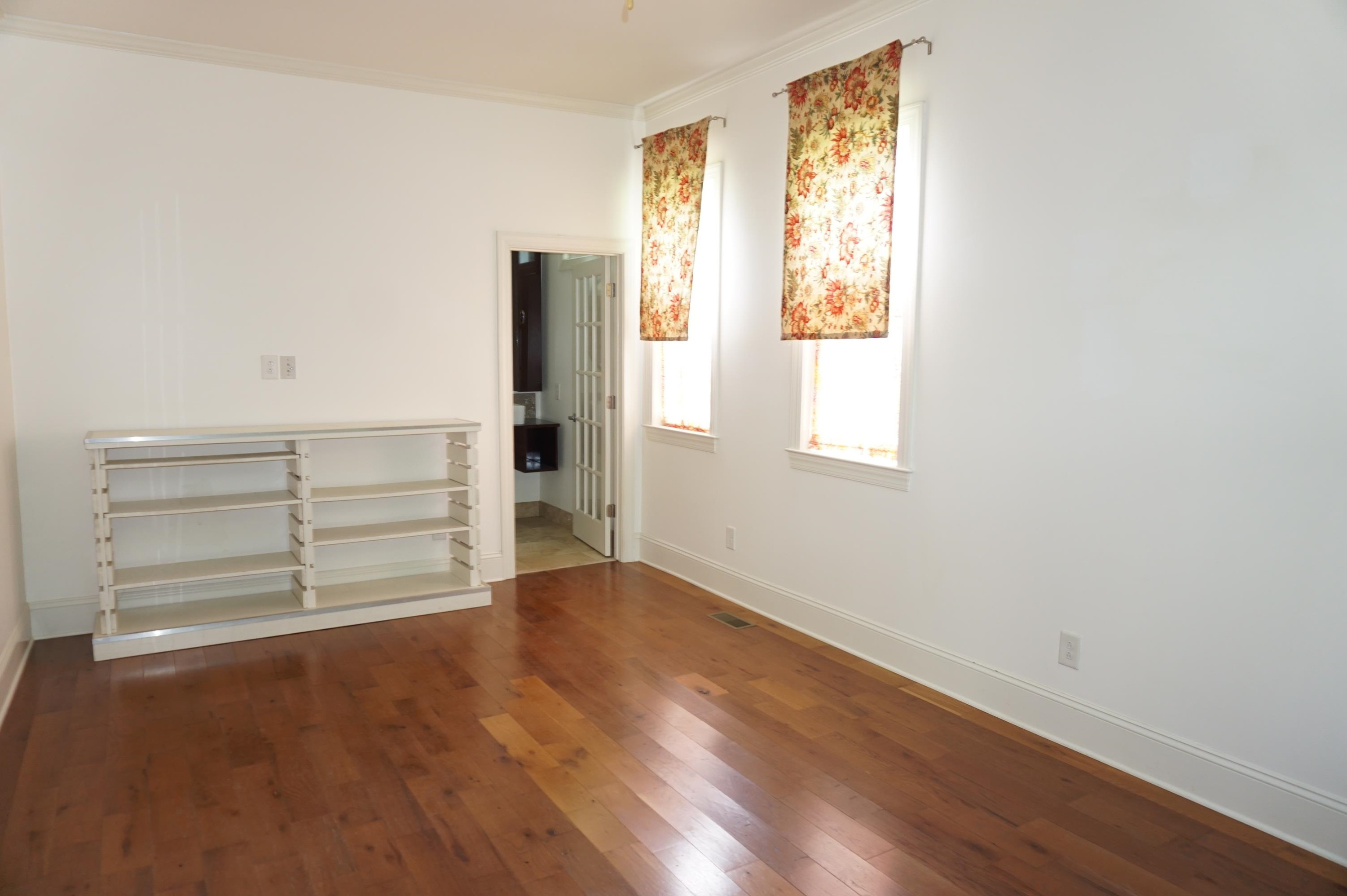 523 East Edenton Street Raleigh, NC 27601 - Photo 20 of 53 an empty room with wooden floor closet and windows