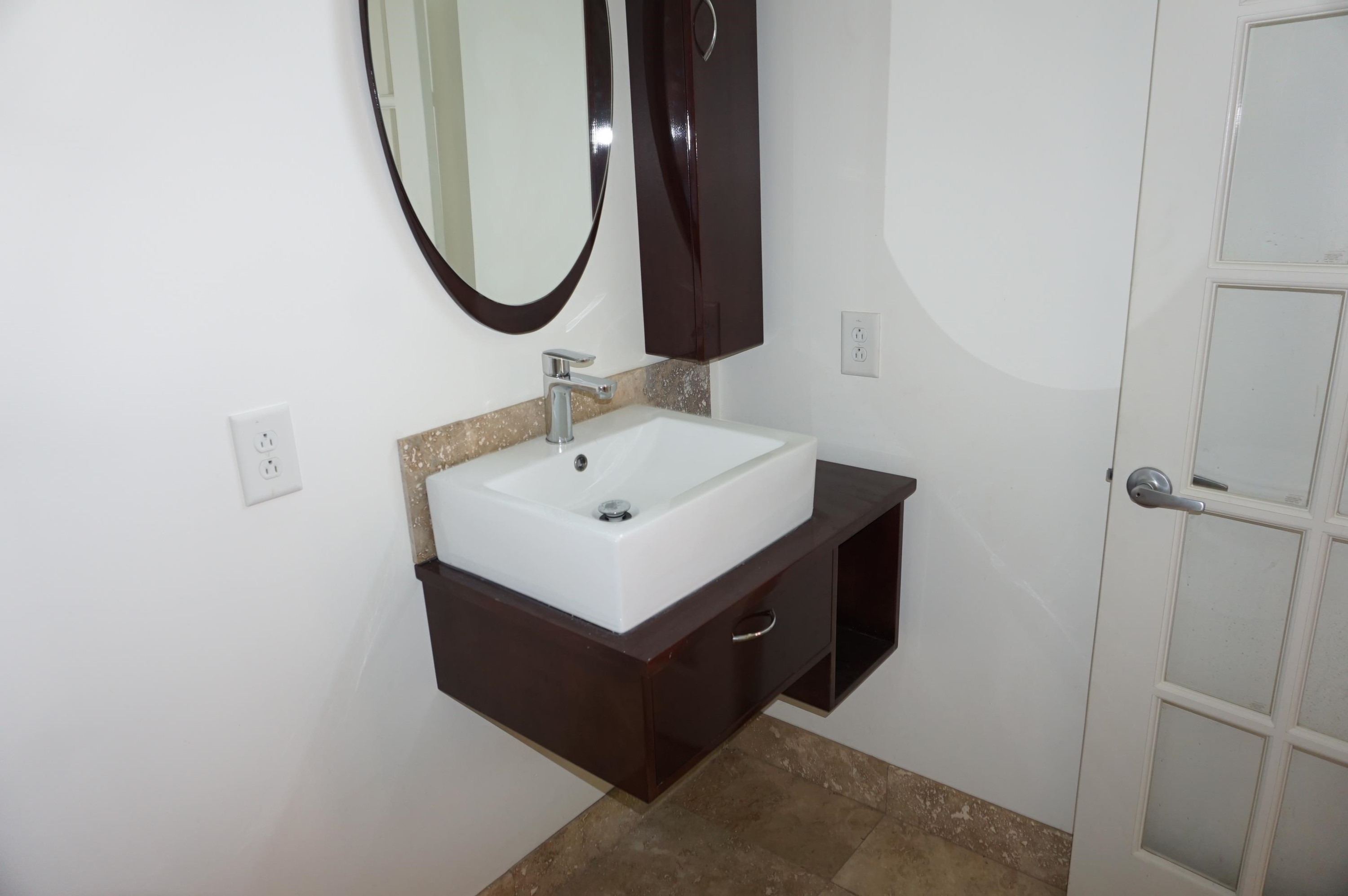523 East Edenton Street Raleigh, NC 27601 - Photo 22 of 53 a bathroom with a sink and a mirror