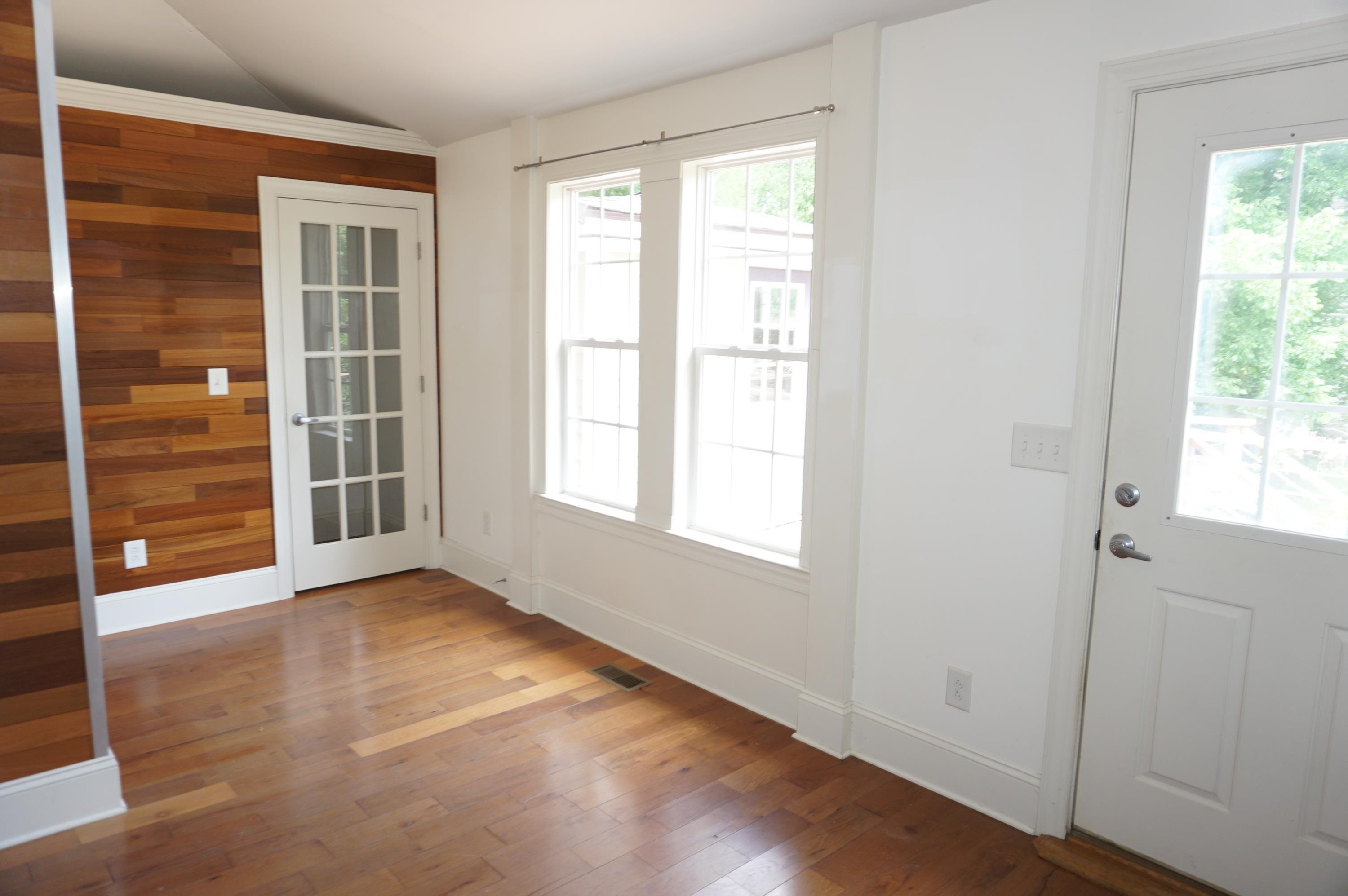 523 East Edenton Street Raleigh, NC 27601 - Photo 28 of 53 a view of an empty room with a window and wooden floor