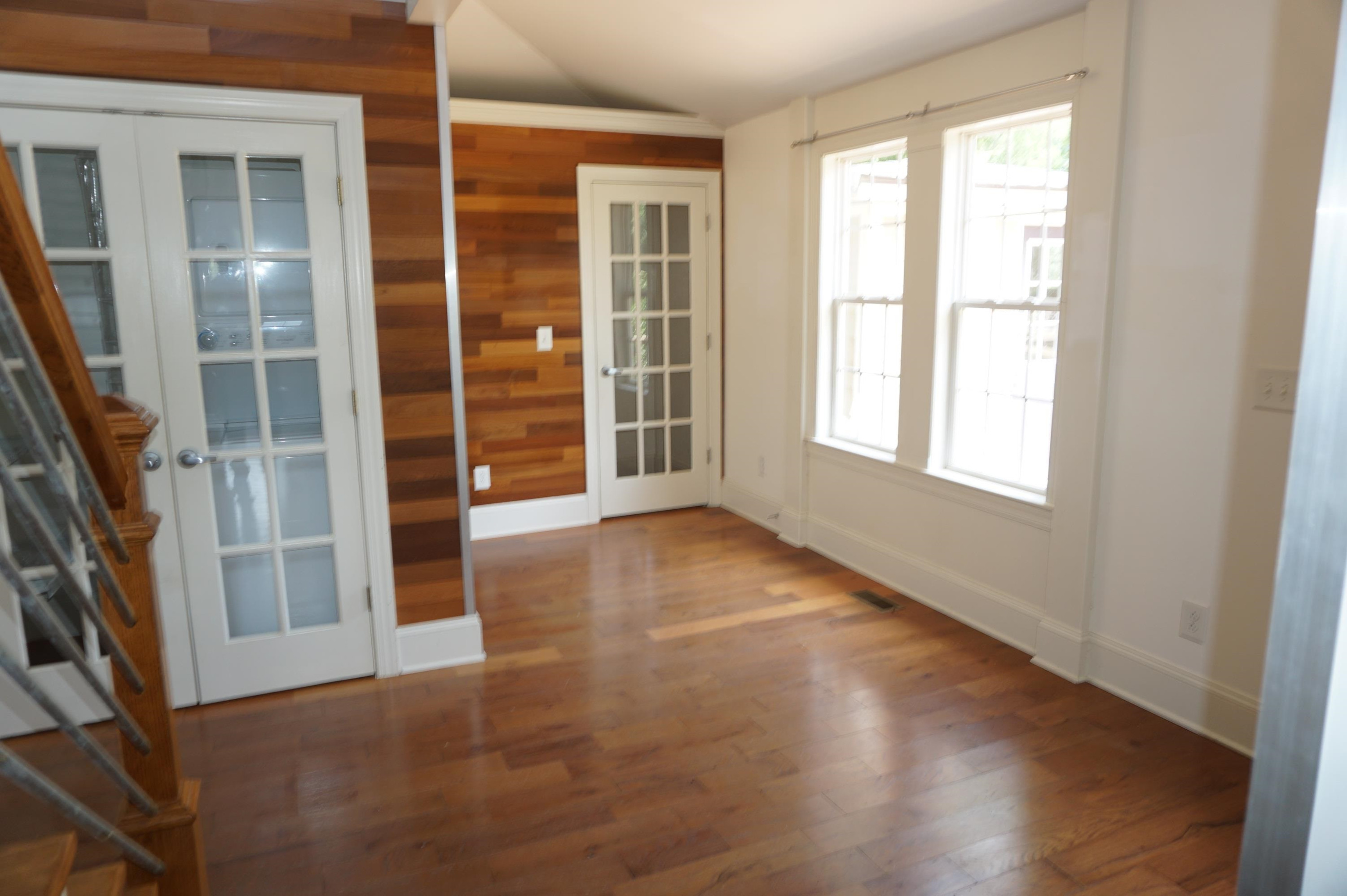 523 East Edenton Street Raleigh, NC 27601 - Photo 29 of 53 an empty room with wooden floor and windows