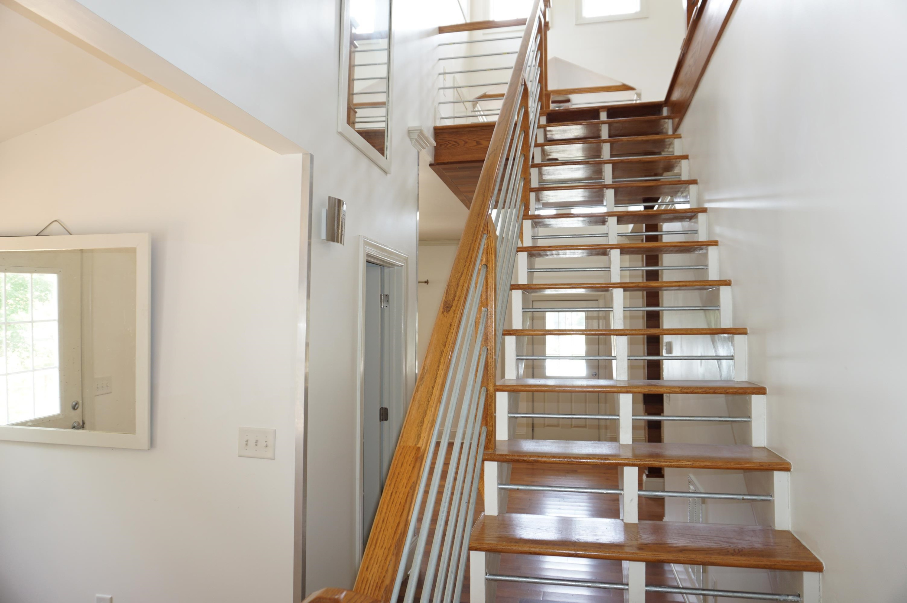 523 East Edenton Street Raleigh, NC 27601 - Photo 38 of 53 a view of staircase with large window