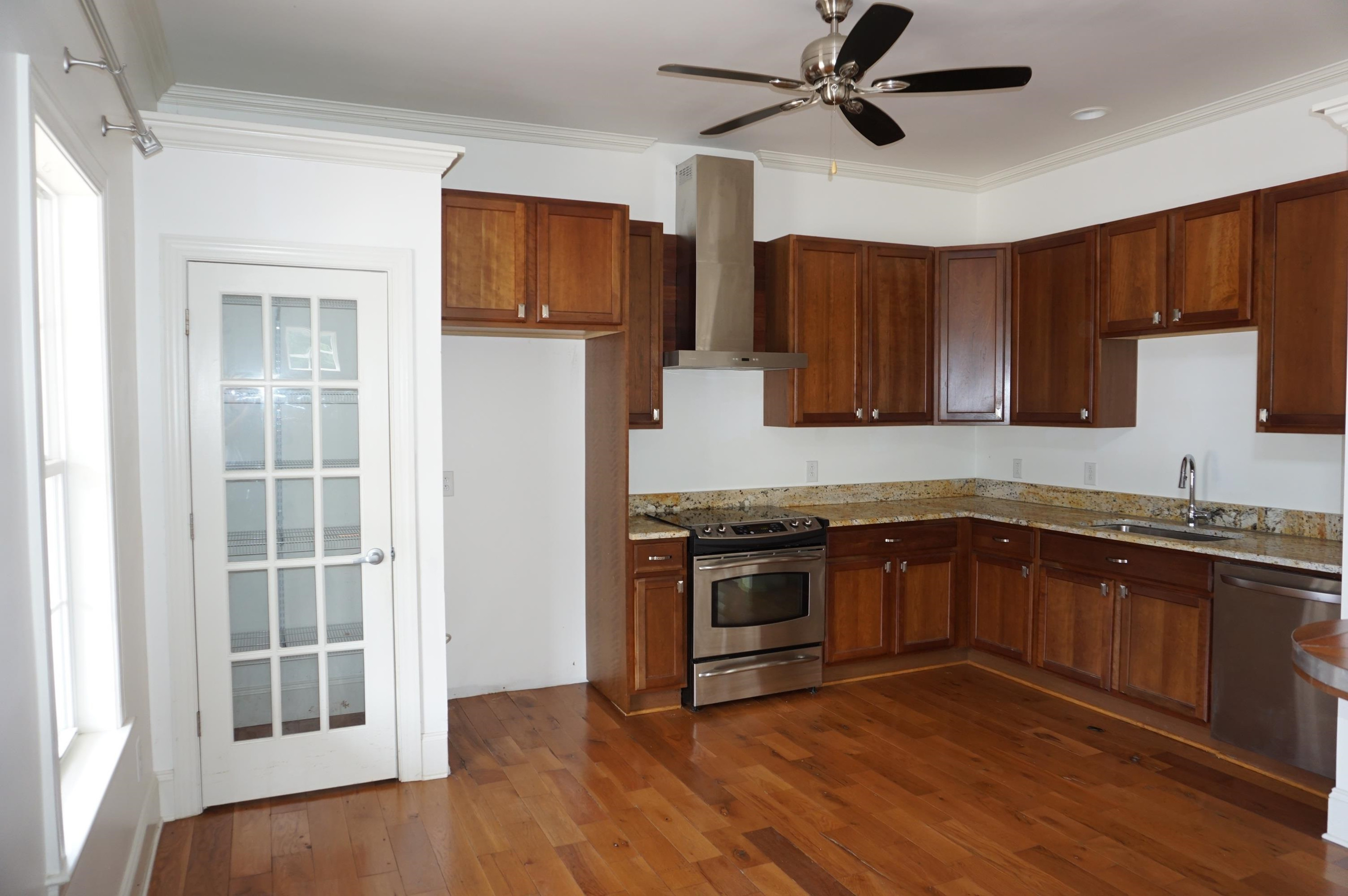 523 East Edenton Street Raleigh, NC 27601 - Photo 6 of 53 a kitchen with stainless steel appliances granite countertop wooden cabinets a refrigerator a sink a stove and a microwave oven