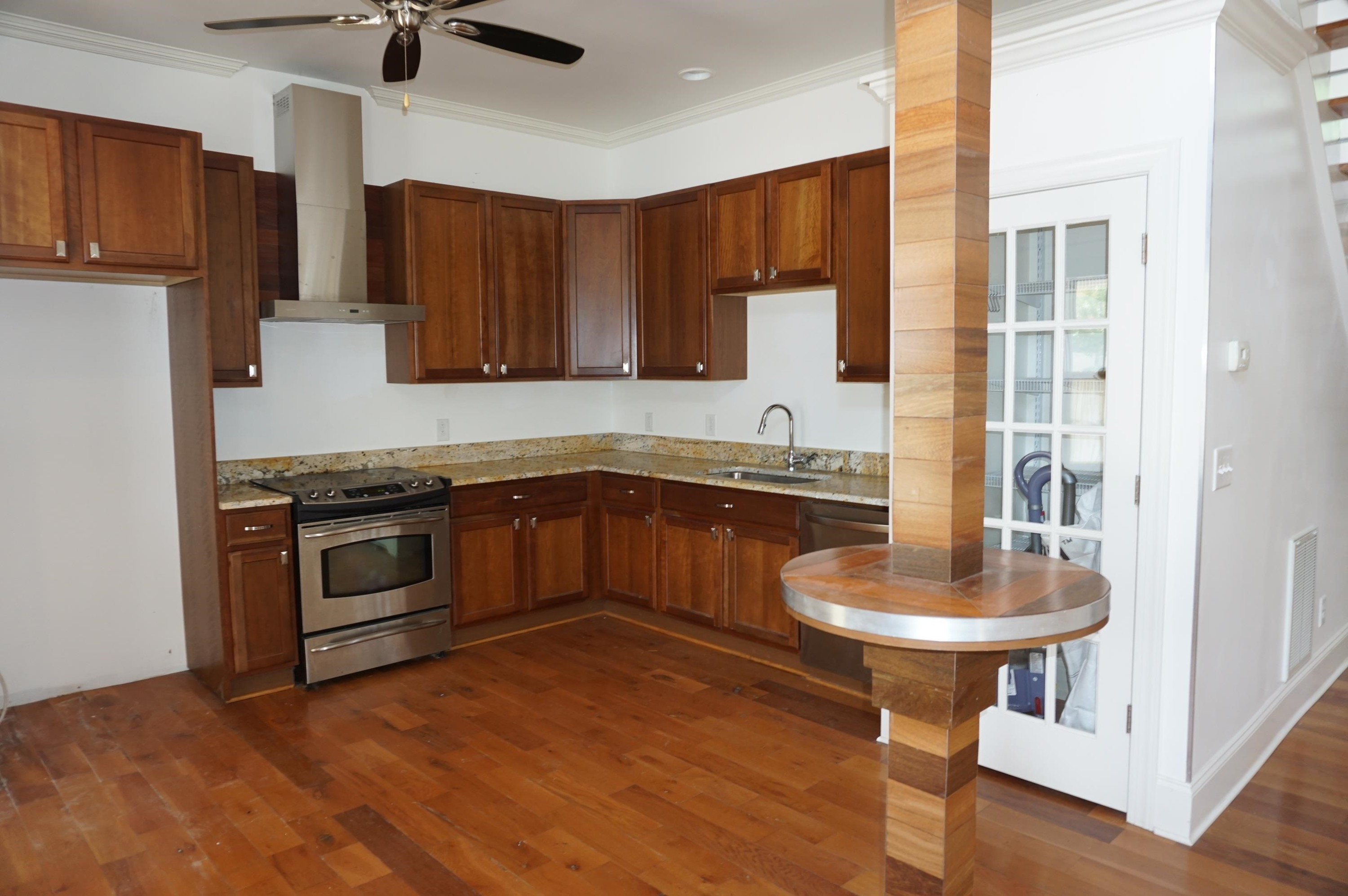 523 East Edenton Street Raleigh, NC 27601 - Photo 8 of 53 a kitchen with stainless steel appliances granite countertop a sink a stove a microwave cabinets and wooden floor