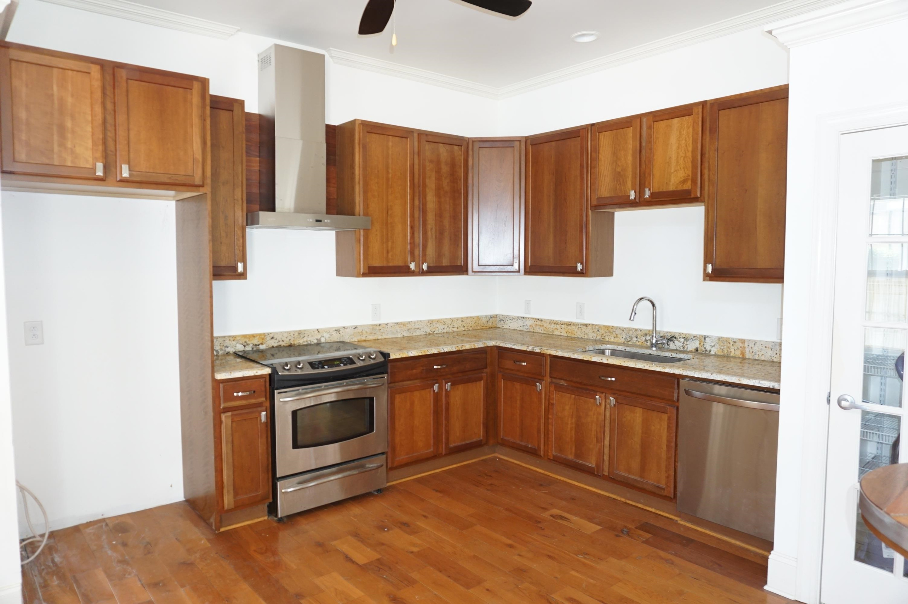 523 East Edenton Street Raleigh, NC 27601 - Photo 9 of 53 a kitchen with stainless steel appliances granite countertop a stove a sink and a refrigerator