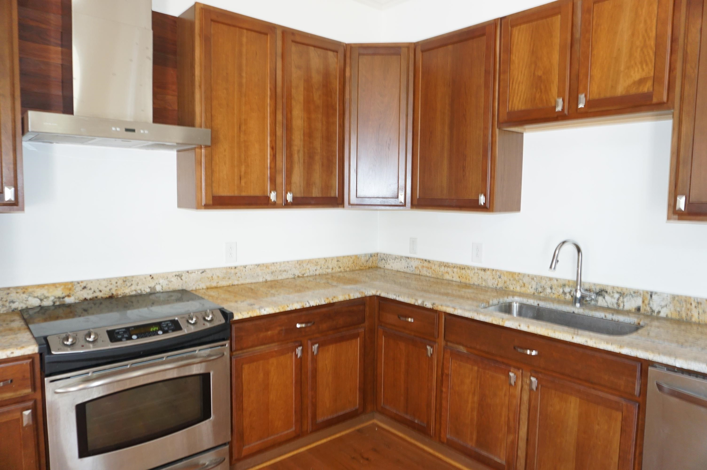 523 East Edenton Street Raleigh, NC 27601 - Photo 10 of 53 a kitchen with a sink stove and cabinets