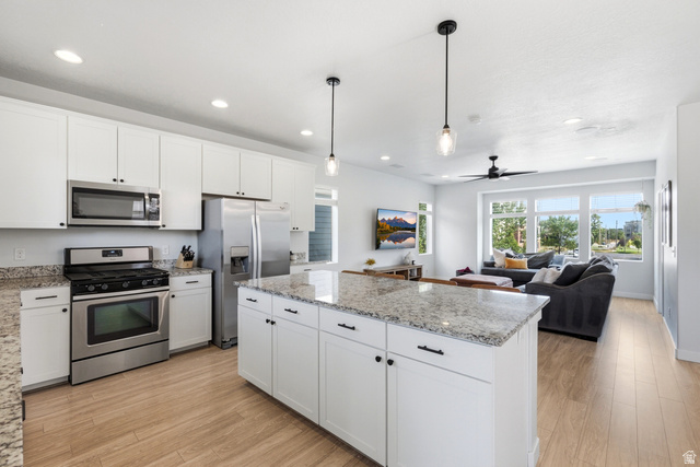 862 Founders Point Lane South Midvale, UT 84047 - Photo 7 of 45 Modern kitchen with white cabinetry and stainless steel appliances