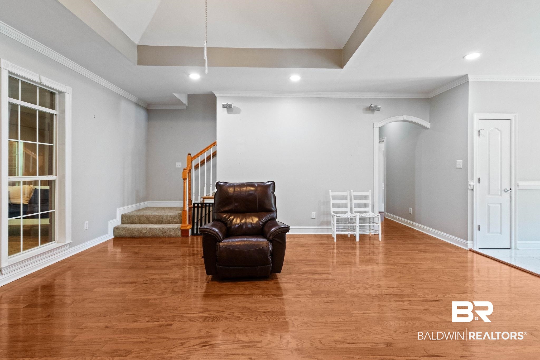 3176 Cedar Court Mobile, AL 36619 - Photo 7 of 33 Spacious interior featuring wood-finish flooring, a tray ceiling, and recessed lighting