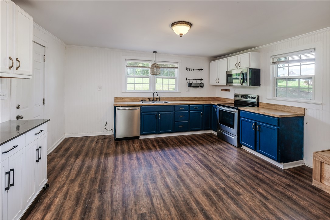 24 Burts Street Pelzer, SC 29669 - Photo 5 of 15 Spacious kitchen with laminate plank flooring, but