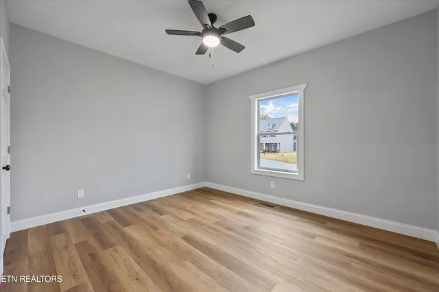 a bathroom with a granite countertop sink a mirror a vanity and a shower