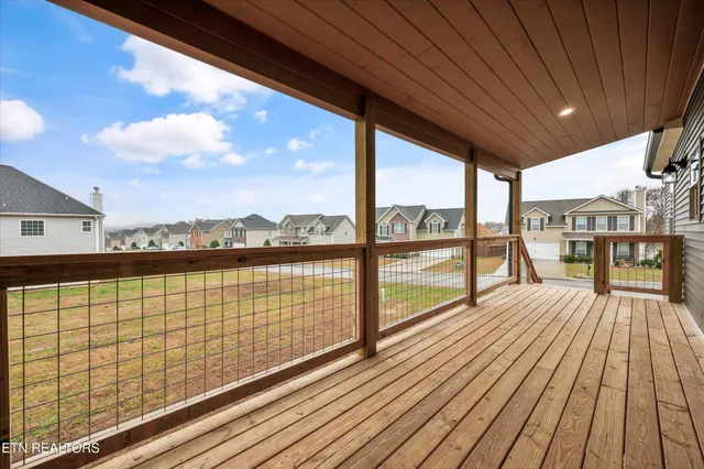 a view of backyard with a balcony