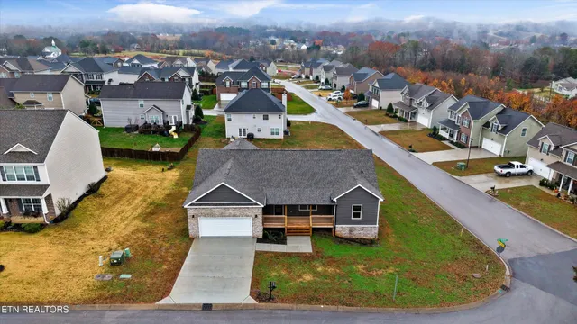 an aerial view of a house with a ocean view