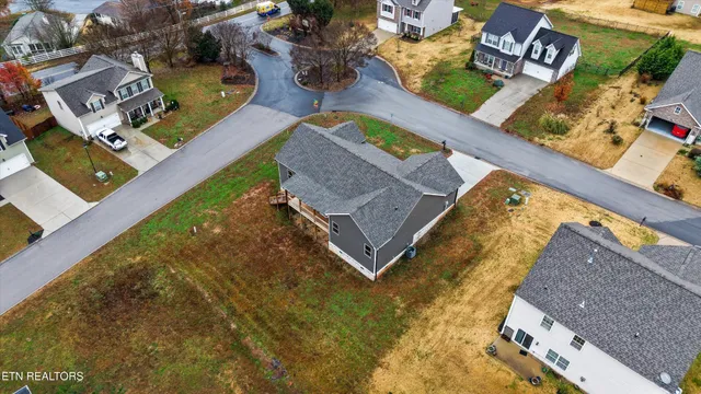 an aerial view of house with yard