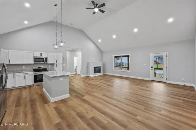 a large kitchen with cabinets a sink and appliances