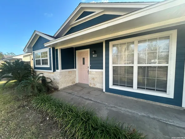 a view of house with backyard
