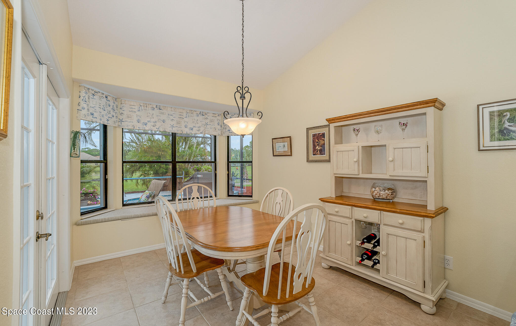 4105 Sand Ridge Drive Merritt Island, FL 32953 - Photo 11 of 31 a dining room with furniture and window