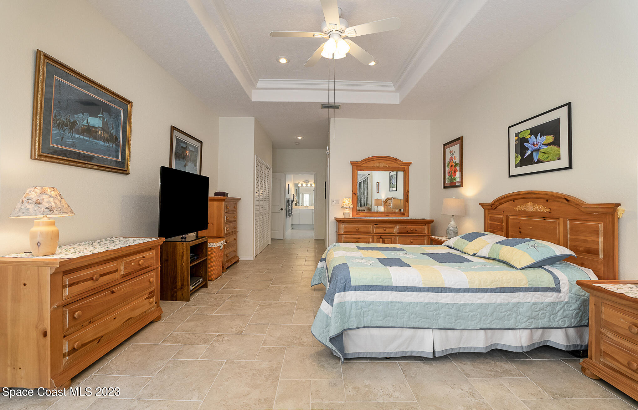4105 Sand Ridge Drive Merritt Island, FL 32953 - Photo 12 of 31 a bedroom with a bed and a flat screen tv