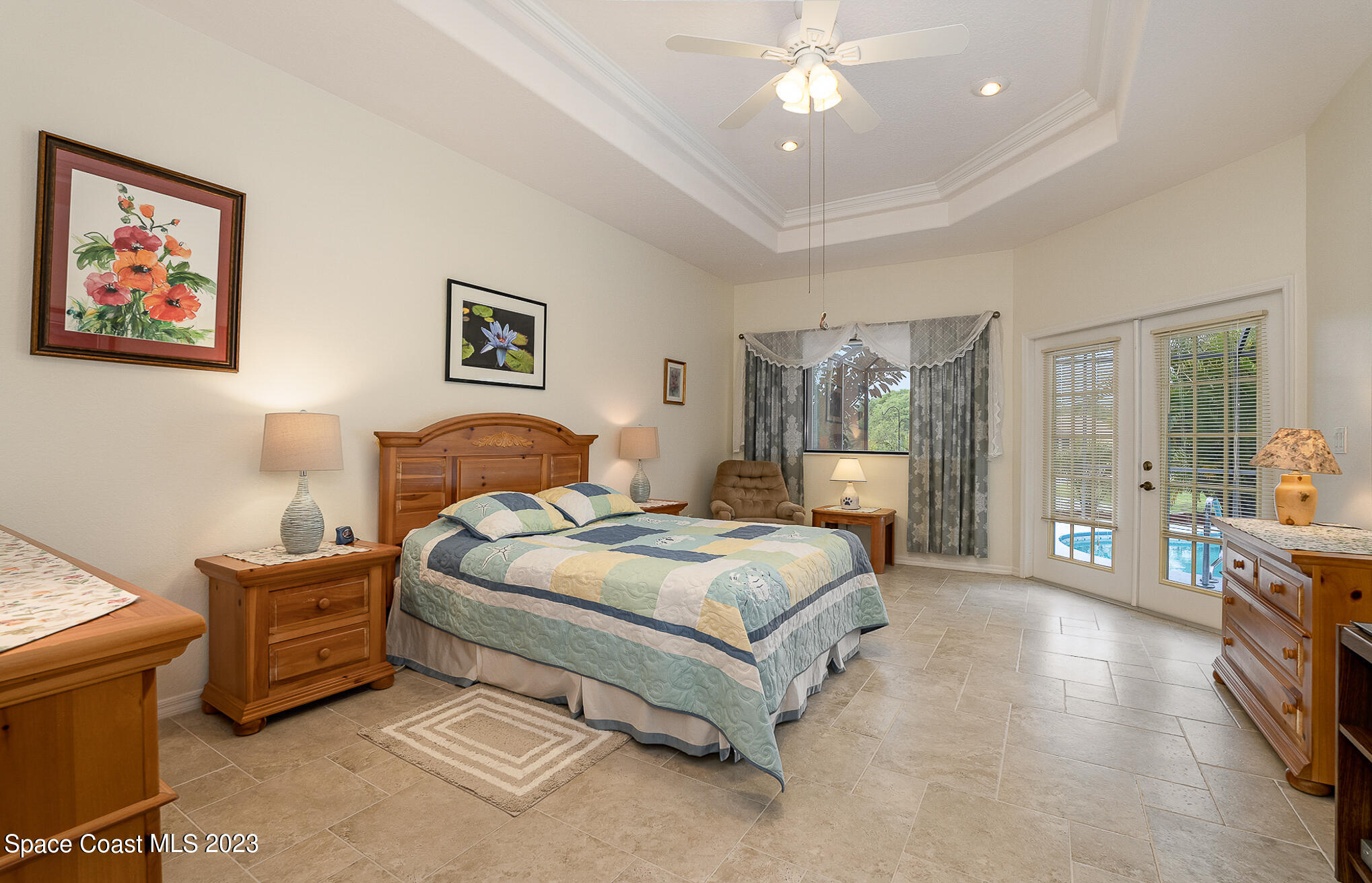 4105 Sand Ridge Drive Merritt Island, FL 32953 - Photo 13 of 31 a spacious bedroom with a bed a couch and dresser