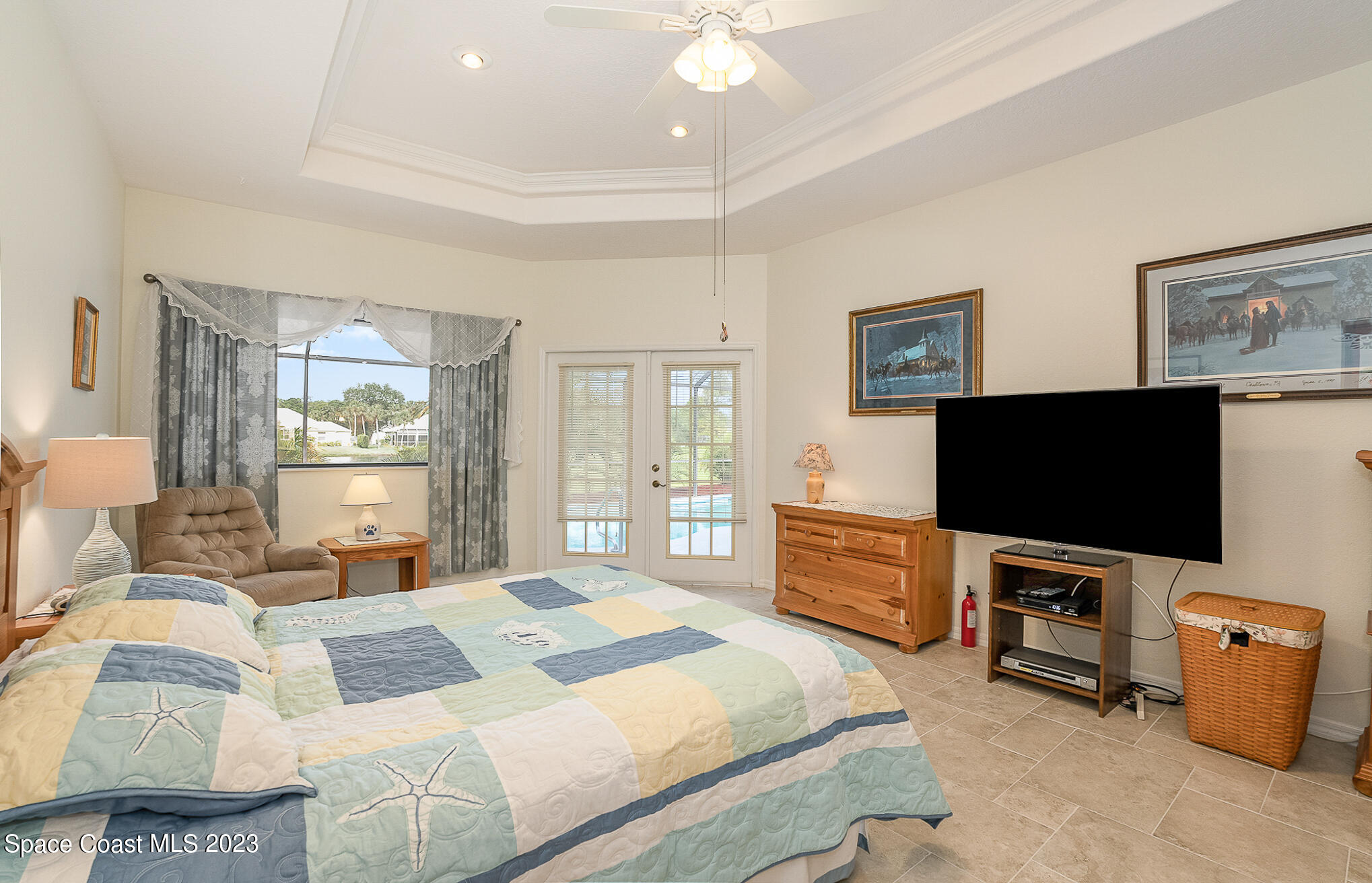 4105 Sand Ridge Drive Merritt Island, FL 32953 - Photo 14 of 31 a bedroom with a bed and a flat screen tv