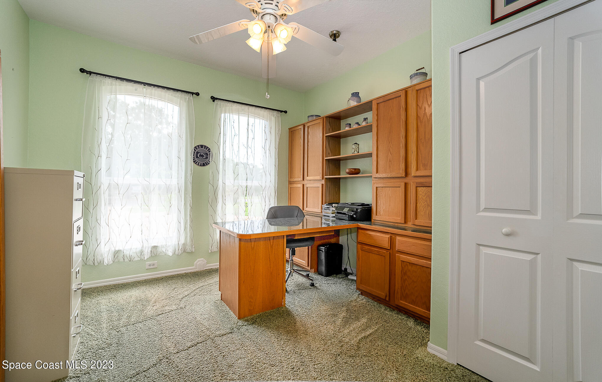 4105 Sand Ridge Drive Merritt Island, FL 32953 - Photo 16 of 31 a kitchen with stainless steel appliances granite countertop a refrigerator and a sink