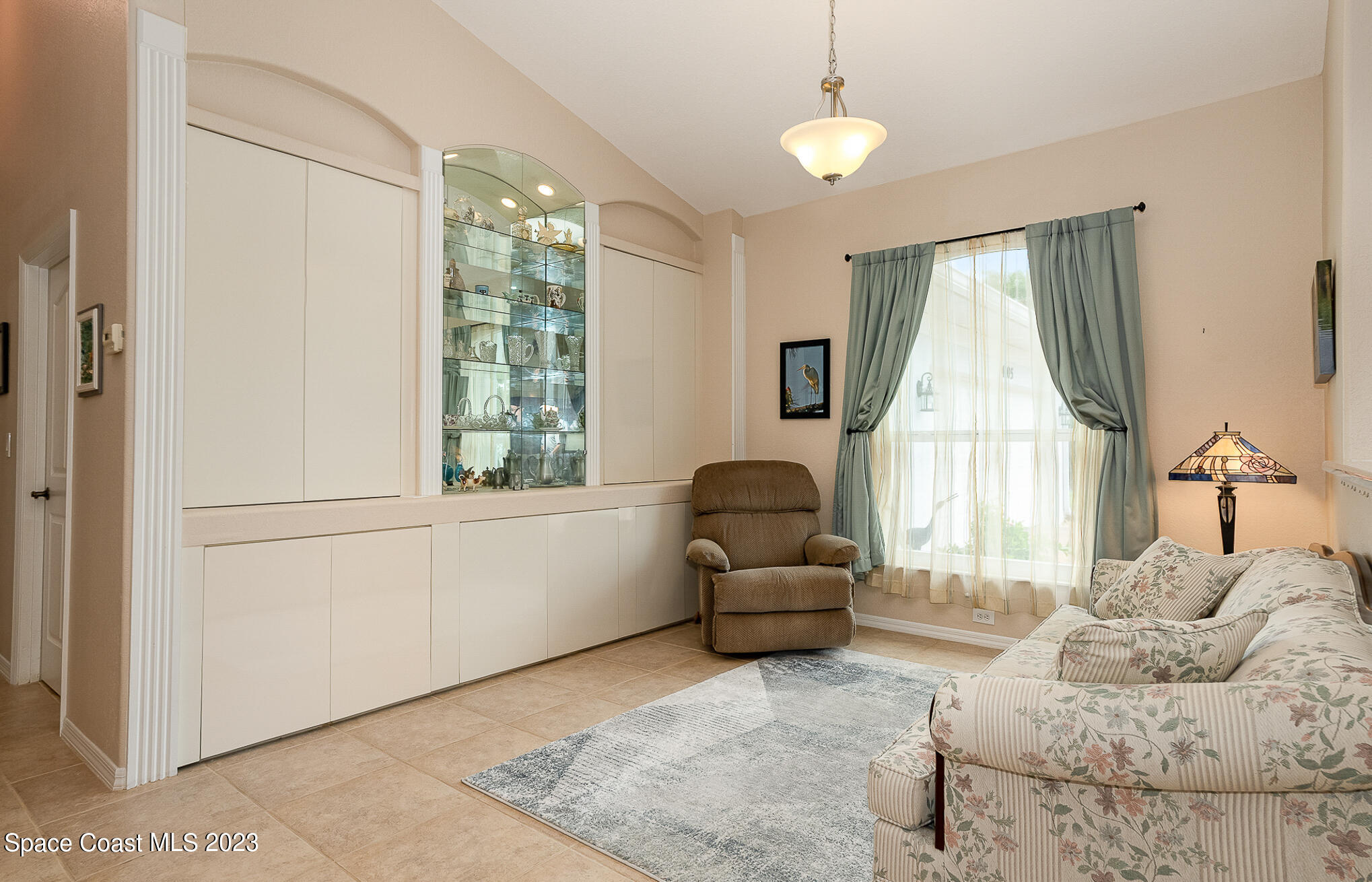 4105 Sand Ridge Drive Merritt Island, FL 32953 - Photo 17 of 31 a living room with furniture and a large window