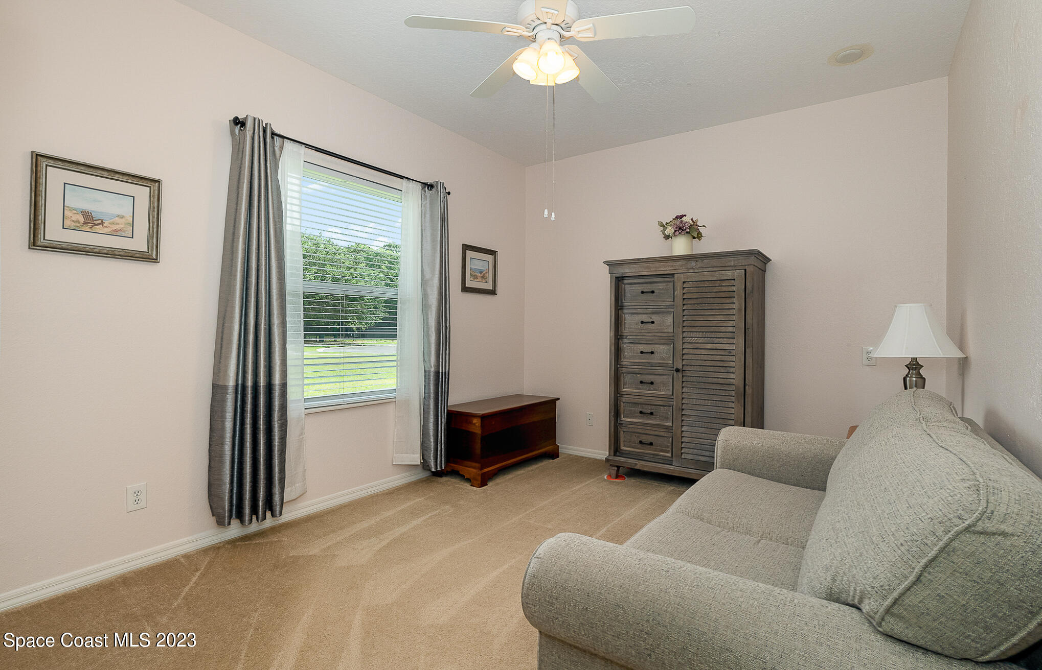 4105 Sand Ridge Drive Merritt Island, FL 32953 - Photo 18 of 31 a living room with furniture and a window