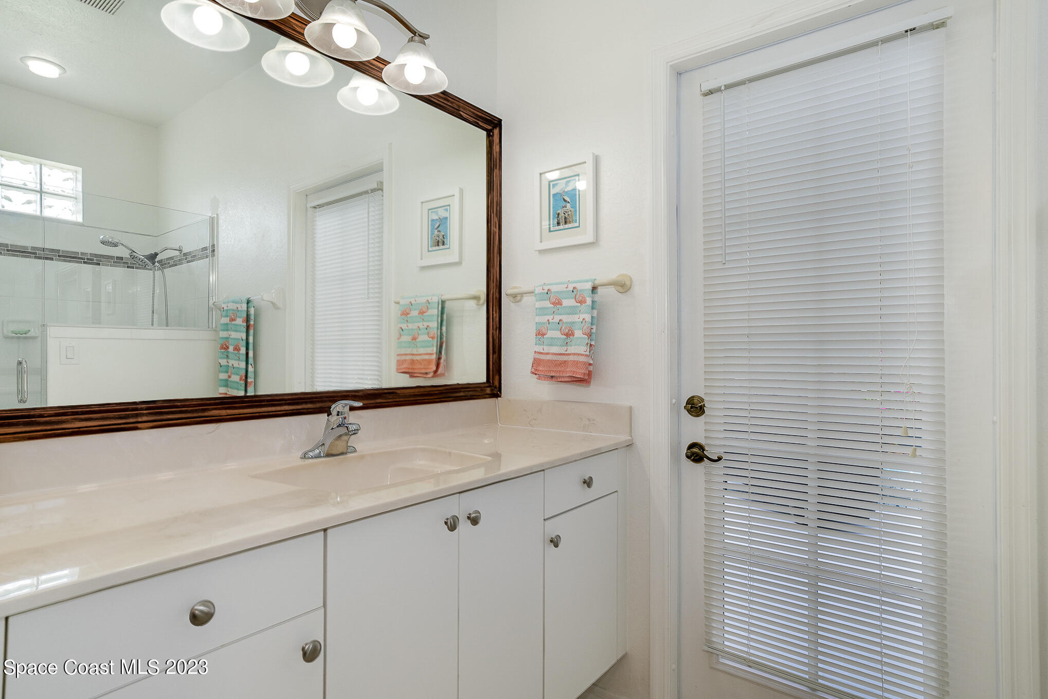 4105 Sand Ridge Drive Merritt Island, FL 32953 - Photo 21 of 31 a bathroom with a sink and a mirror