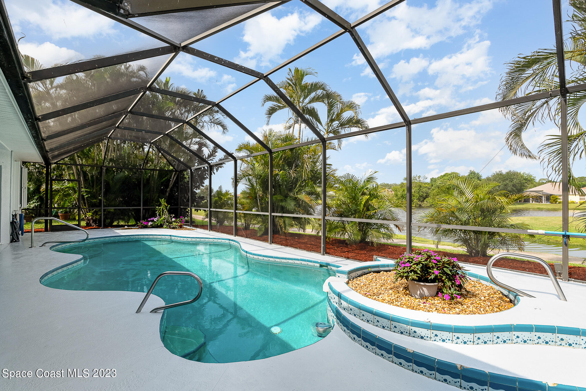 4105 Sand Ridge Drive Merritt Island, FL 32953 - Photo 25 of 31 a view of a swimming pool with a sitting area