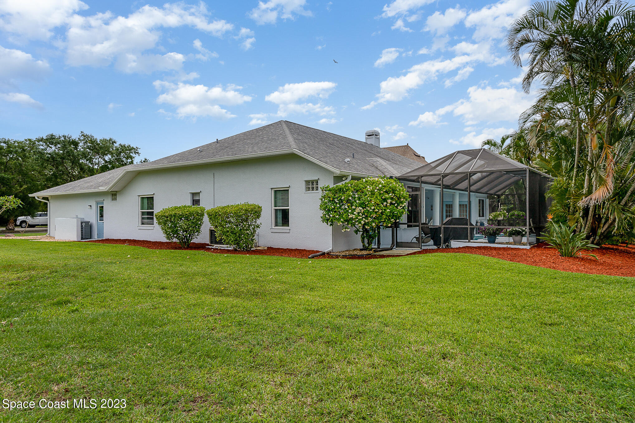 4105 Sand Ridge Drive Merritt Island, FL 32953 - Photo 26 of 31 a front view of a house with garden