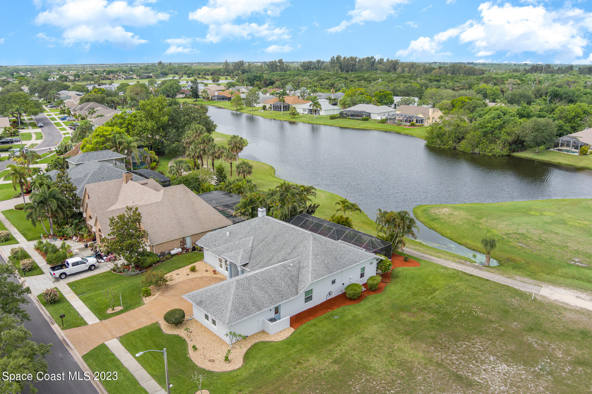 4105 Sand Ridge Drive Merritt Island, FL 32953 - Photo 28 of 31 an aerial view of residential houses with outdoor space and river