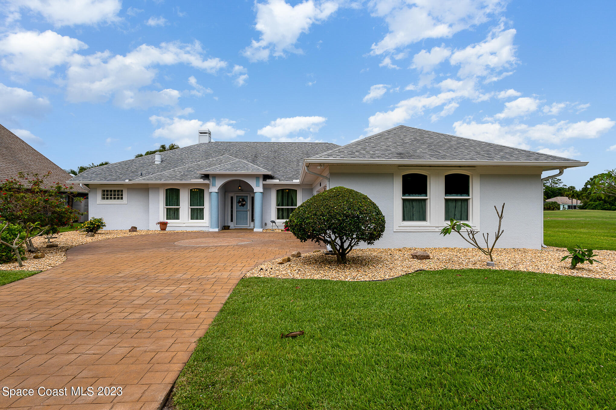 4105 Sand Ridge Drive Merritt Island, FL 32953 - Photo 3 of 31 a front view of a house with a yard and porch