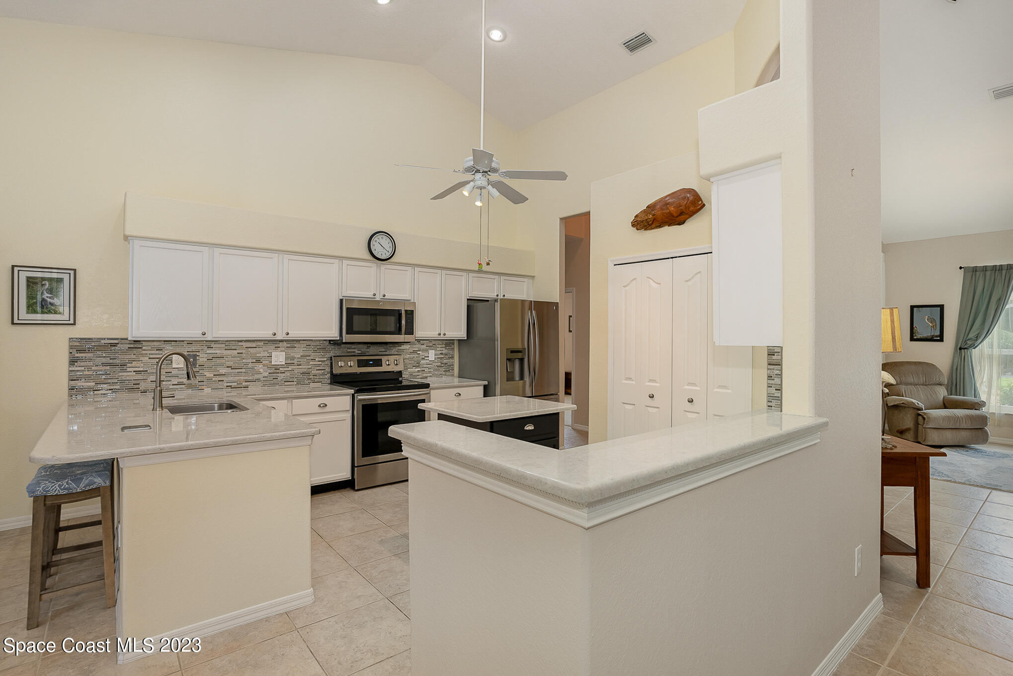 4105 Sand Ridge Drive Merritt Island, FL 32953 - Photo 9 of 31 a kitchen with a sink a stove and oven