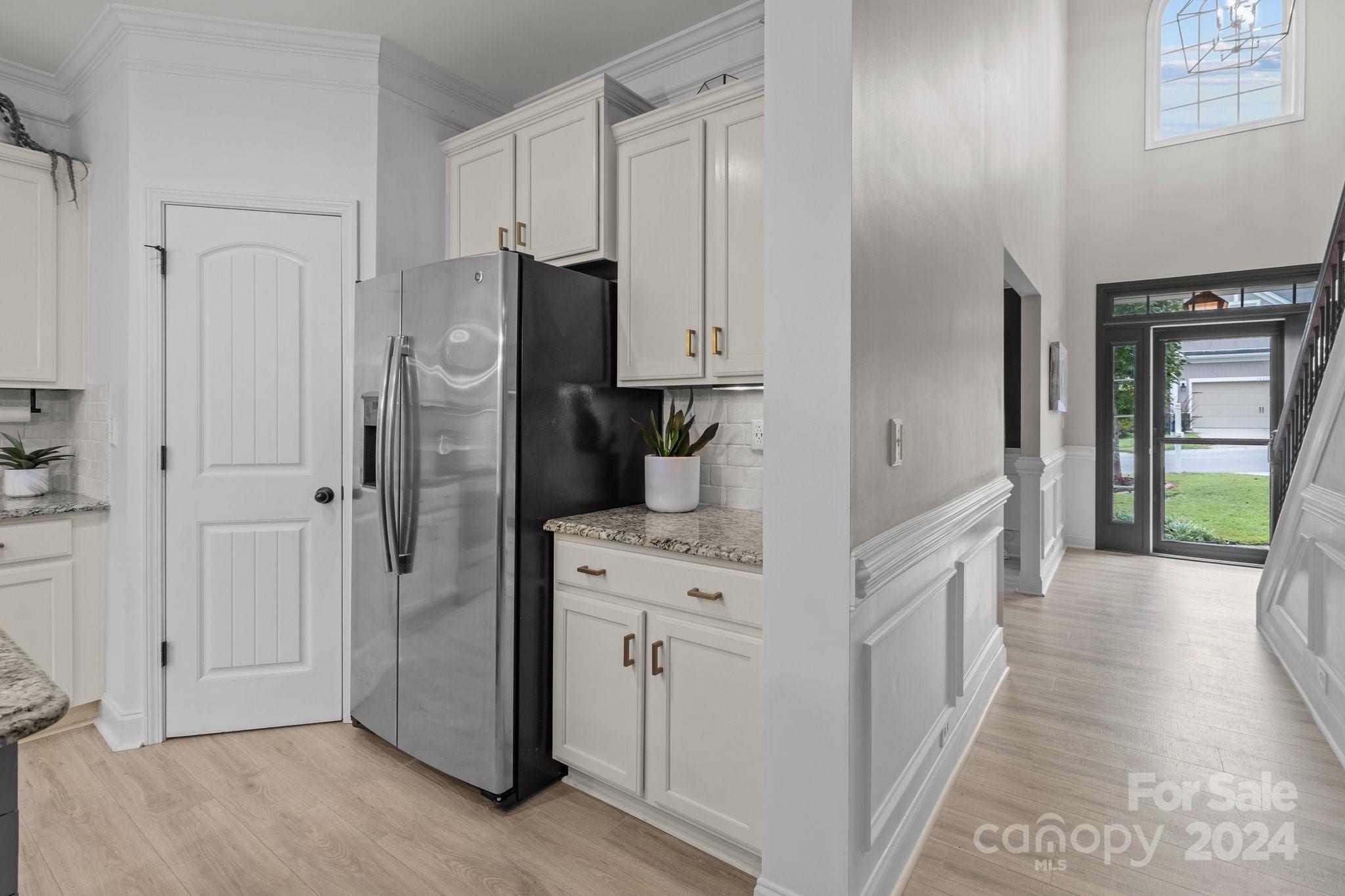 3434 Streamside Drive Davidson, NC 28036 - Photo 10 of 34 a kitchen with cabinets and a refrigerator