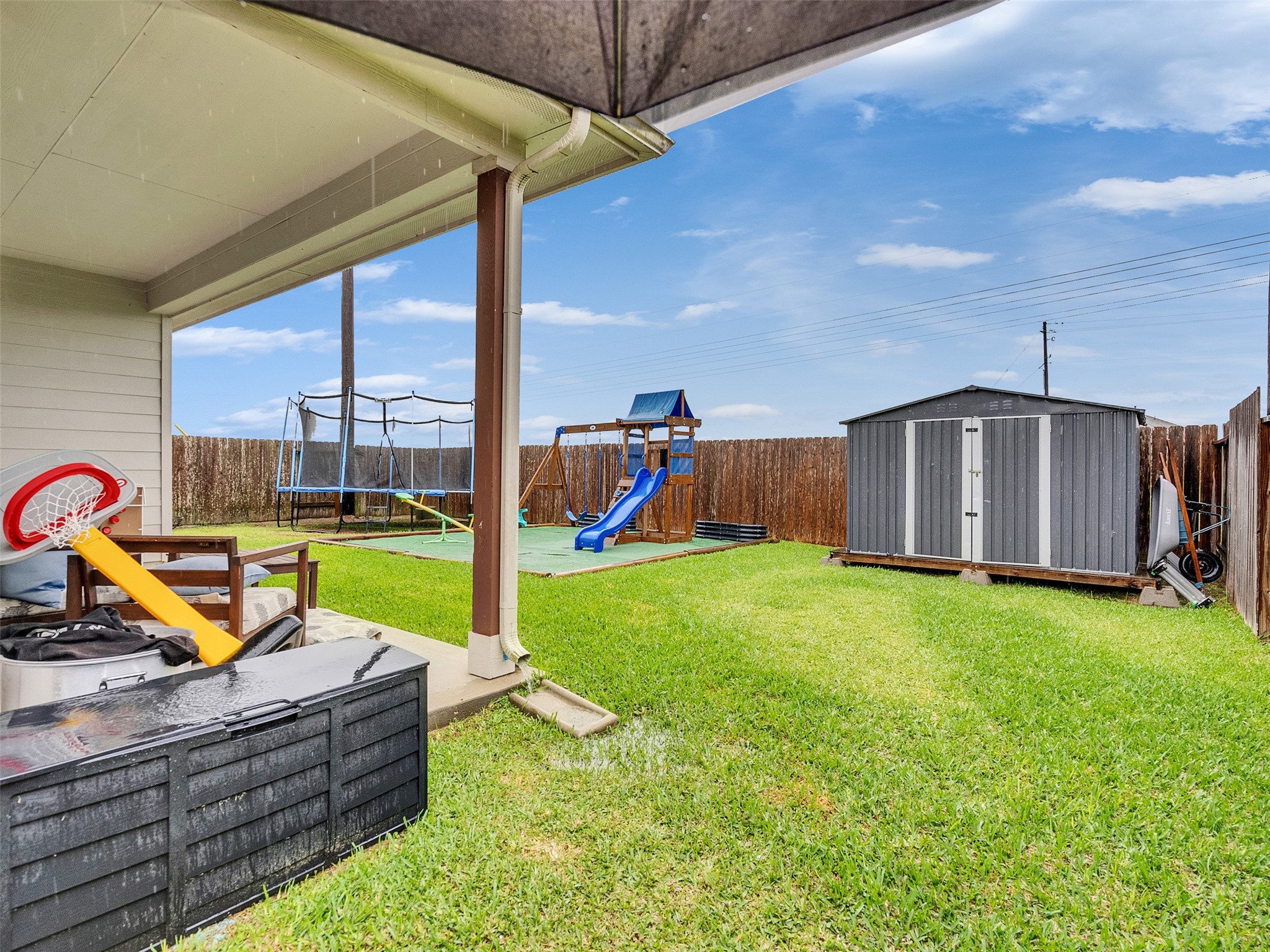 8719 Willet Street Baytown, TX 77521 - Photo 40 of 42 a view of a garden with a slide