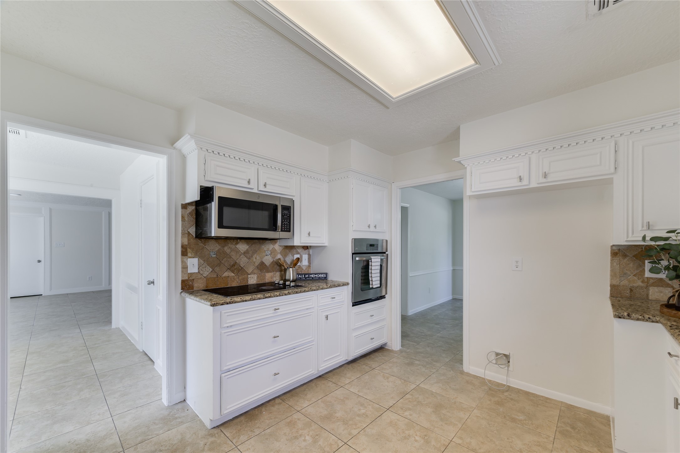 18318 Ella Boulevard Spring, TX 77388 - Photo 12 of 50 a kitchen with a refrigerator and a sink