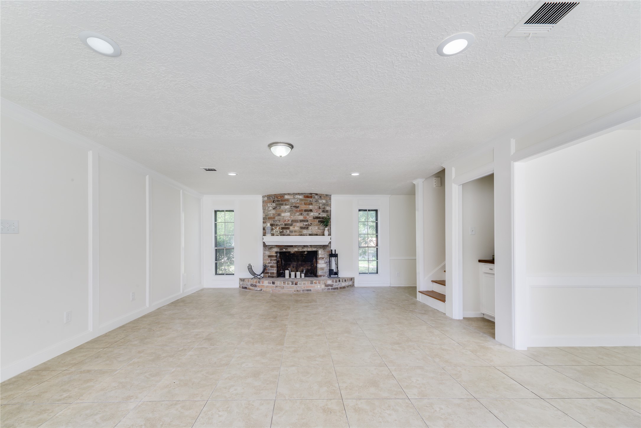 18318 Ella Boulevard Spring, TX 77388 - Photo 19 of 50 an empty room with furniture and fireplace